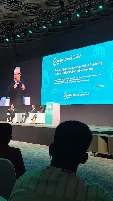 A panel on stage at Open Source Summit India about open source innovation powering India's digital public infrastructure